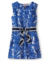 The classic shift dress gets an updated with goldtone Juicy Couture logo buttons, ribbon belt, and a smocked waistline for a trimmer silhouette. The classic shift dress gets an updated with goldtone Juicy Couture logo buttons, ribbon belt, and a smocked waistline for a trimmer silhouette.