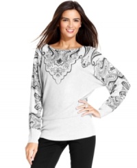 A pattern at the chest and sleeves elevates this metallic knit, dolman sleeve sweater from Alfani. A pattern at the chest and sleeves elevates this metallic knit, dolman sleeve sweater from Alfani.