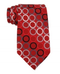 Vibrant colors and a neat geometric print make this smooth silk tie from Michael Kors a must-have for any guy's tailored wardrobe. Vibrant colors and a neat geometric print make this smooth silk tie from Michael Kors a must-have for any guy's tailored wardrobe.