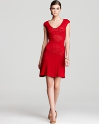 Go for bold in this bright red Catherine Malandrino dress with pointelle detail. The cut of the skirt creates a flirtatious movement so a simple stride becomes a fashionable strut. Go for bold in this bright red Catherine Malandrino dress with pointelle detail. The cut of the skirt creates a flirtatious movement so a simple stride becomes a fashionable strut.