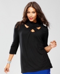 Cool cutouts put a new twist on a plus size turtleneck, from INC. Cool cutouts put a new twist on a plus size turtleneck, from INC.