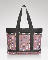 Travel light with this LeSportsac nylon tote, which features a lined interior and effortless double top handles. A playful print updates this signature style.
