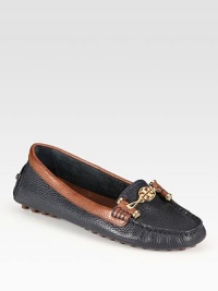 Finished with a rubber sole, this pebbled leather style is accentuated by contrasting trim and a goldtone designer emblem. Leather upperLeather liningRubber solePadded insoleImportedOUR FIT MODEL RECOMMENDS ordering true size Finished with a rubber sole, this pebbled leather style is accentuated by contrasting trim and a goldtone designer emblem. Leather upperLeather liningRubber solePadded insoleImportedOUR FIT MODEL RECOMMENDS ordering true size