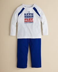 This classic warm up set from Under Armour features a thick fleece hoodie and elastic-waist paint, each prominently displaying logo lettering in prints and patches. This classic warm up set from Under Armour features a thick fleece hoodie and elastic-waist paint, each prominently displaying logo lettering in prints and patches.
