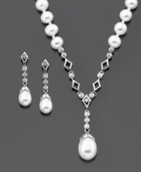 Smooth style that raises the bar. This gorgeous pendant and earring set features cultured freshwater pearls (5-9 mm) set in sterling silver. Pendant measures approximately 15 inches with a 2-inch drop. Earrings measure approximately 3/4 inch. Smooth style that raises the bar. This gorgeous pendant and earring set features cultured freshwater pearls (5-9 mm) set in sterling silver. Pendant measures approximately 15 inches with a 2-inch drop. Earrings measure approximately 3/4 inch.