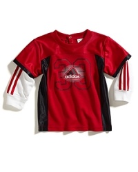 A sporty look featuring Adidas' iconic styling on a football jersey, updated with mesh insets for the layered look without the bulk. A sporty look featuring Adidas' iconic styling on a football jersey, updated with mesh insets for the layered look without the bulk.