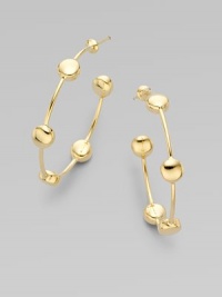 Hoops of 18k yellow gold dotted with circles create a modern yet timeless design to outlast every season.18k yellow gold Diameter, about 1½ Post backs Imported Hoops of 18k yellow gold dotted with circles create a modern yet timeless design to outlast every season.18k yellow gold Diameter, about 1½ Post backs Imported