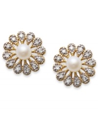 A brilliant burst of sparkle. These dazzling stud earrings feature a halo of round-cut diamonds (1/10 ct. t.w.) and a cultured freshwater pearl at center (3-3-1/2 mm). Set in 14k gold. Approximate diameter: 3/8 inch. A brilliant burst of sparkle. These dazzling stud earrings feature a halo of round-cut diamonds (1/10 ct. t.w.) and a cultured freshwater pearl at center (3-3-1/2 mm). Set in 14k gold. Approximate diameter: 3/8 inch.