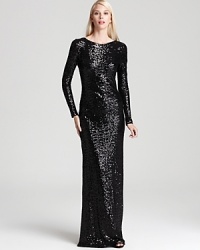 A cowl back lends chic intrigue to Badgley Mischka's long sleeve, sequined gown. A cowl back lends chic intrigue to Badgley Mischka's long sleeve, sequined gown.
