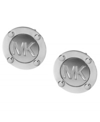 It's all in the name. Michael Kors' edgy stud earrings feature stud and logo detail in silver tone mixed metal. Approximate diameter: 1/2 inch. It's all in the name. Michael Kors' edgy stud earrings feature stud and logo detail in silver tone mixed metal. Approximate diameter: 1/2 inch.