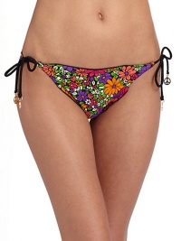 Cheery floral graphics teamed with ruffle edges, make a fun and flirty string bottom.Elastic waistband Side ties with peace charms Ruffle edges Fully lined 82% nylon/18% spandex Fully lined Hand wash Made in USA of imported fabricPlease note: Bikini bottom sold separately. Cheery floral graphics teamed with ruffle edges, make a fun and flirty string bottom.Elastic waistband Side ties with peace charms Ruffle edges Fully lined 82% nylon/18% spandex Fully lined Hand wash Made in USA of imported fabricPlease note: Bikini bottom sold separately.