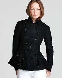 A preppy favorite goes seriously punk--cropped styling and slim tailoring add some edge to the essential Burberry Brit peacoat. Team with leather leggings and clock into cool. A preppy favorite goes seriously punk--cropped styling and slim tailoring add some edge to the essential Burberry Brit peacoat. Team with leather leggings and clock into cool.