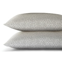 An animal print for a mellow palette-quiet white spots against a muted grey background.