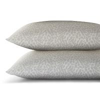 An animal print for a mellow palette-quiet white spots against a muted grey background.