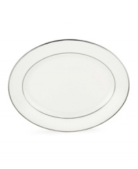 Beautiful and bridal-inspired, this oval platter is richly textured with a delicate floral motif and raised, beaded accents. Finished with a band of polished platinum. Beautiful and bridal-inspired, this oval platter is richly textured with a delicate floral motif and raised, beaded accents. Finished with a band of polished platinum.
