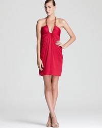 A hit of hardware lends a trend-right look to BCBGMAXAZRIA's standout halter dress--a plunging neckline flaunts the figure. A hit of hardware lends a trend-right look to BCBGMAXAZRIA's standout halter dress--a plunging neckline flaunts the figure.