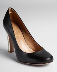 A snake embossed heel makes an unforgettable exit on Elie Tahari's Harper pumps. A snake embossed heel makes an unforgettable exit on Elie Tahari's Harper pumps.