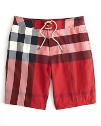 When you're basking under the sun in St. Tropez or body surfing off the east coast, these cool and distinctive swim shorts keep you covered in Burberry's distinctive check pattern. When you're basking under the sun in St. Tropez or body surfing off the east coast, these cool and distinctive swim shorts keep you covered in Burberry's distinctive check pattern.
