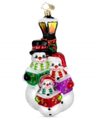 A family of caroling snowmen hits all the season's high notes in exquisite, handcrafted glass. Glitter snowflakes, music books and bright, shiny color give the ornament that classic Christopher Radko feel. A family of caroling snowmen hits all the season's high notes in exquisite, handcrafted glass. Glitter snowflakes, music books and bright, shiny color give the ornament that classic Christopher Radko feel.
