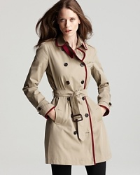 Burberry Brit trims the classic trench in vibrant red, updating the timeless, must-have style with modern details. Pair this staple with a monochromatic look underneath for a forward look. Burberry Brit trims the classic trench in vibrant red, updating the timeless, must-have style with modern details. Pair this staple with a monochromatic look underneath for a forward look.