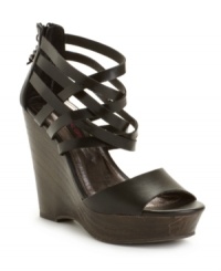 Turn your look around. The Twister sandals by Material Girl take your look from casual to covetable with their intertwined straps, back zipper and stacked wedge heel. Turn your look around. The Twister sandals by Material Girl take your look from casual to covetable with their intertwined straps, back zipper and stacked wedge heel.