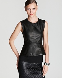 Turn up the glamour quotient with this sleek leather DIANE von FURSTENBERG top--a pop of a peplum is one of our favorite fall trends that adds ladylike panache to this dark beauty. Turn up the glamour quotient with this sleek leather DIANE von FURSTENBERG top--a pop of a peplum is one of our favorite fall trends that adds ladylike panache to this dark beauty.