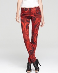 Expand your denim horizons and reach for these vibrant Alice + Olivia jeans--covered in a romantic rose print, these standout skinnies add a colorful new vision to your blues collection. Expand your denim horizons and reach for these vibrant Alice + Olivia jeans--covered in a romantic rose print, these standout skinnies add a colorful new vision to your blues collection.