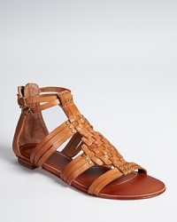 In a gladiator-inspired silhouette, Dolce Vita's Cybele woven sandals offer a streamlined look with woven and studded details. In a gladiator-inspired silhouette, Dolce Vita's Cybele woven sandals offer a streamlined look with woven and studded details.