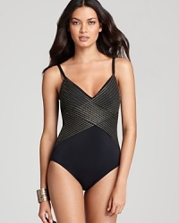 Add a little disco-retro magic to your swim wardrobe with this Gottex swimsuit, with vintage-style metallic stripes and slender, shoulder-defining spaghetti straps. Add a little disco-retro magic to your swim wardrobe with this Gottex swimsuit, with vintage-style metallic stripes and slender, shoulder-defining spaghetti straps.