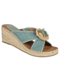 For an easy and sun-kissed look, slip on the homespun Racy wedge sandals with a pair of shorts. A crafty bow tops off the crisscrossing fabric straps. For an easy and sun-kissed look, slip on the homespun Racy wedge sandals with a pair of shorts. A crafty bow tops off the crisscrossing fabric straps.