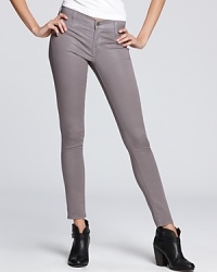 A slick coated wash brings a cool leather-like finish to these skinny jeans from James Jeans. A slick coated wash brings a cool leather-like finish to these skinny jeans from James Jeans.