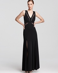 Sheer lace details lend allure to a sophisticated BCBGMAXAZRIA gown. Sheer lace details lend allure to a sophisticated BCBGMAXAZRIA gown.