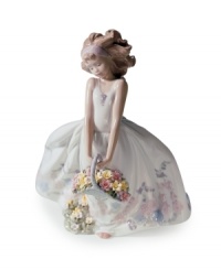 Flower girl. With a basket full of blooms and a pretty gown of exquisite porcelain, this sweet Lladro figurine recalls a girl's first wedding or special Easter moment.