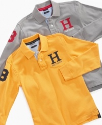 The polo shirt is in play: Tommy Hilfiger updates the classic with a capital H graphic, long sleeves, and a number patch, and winds up with a style that will carry any boy straight through the school year. The polo shirt is in play: Tommy Hilfiger updates the classic with a capital H graphic, long sleeves, and a number patch, and winds up with a style that will carry any boy straight through the school year.