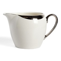 This creamer glows with a hand-painted bright platinum design to create a contemporary classic on your table that will complement your dining experience throughout a lifetime of shifting trends and evolving fashions. This creamer glows with a hand-painted bright platinum design to create a contemporary classic on your table that will complement your dining experience throughout a lifetime of shifting trends and evolving fashions.