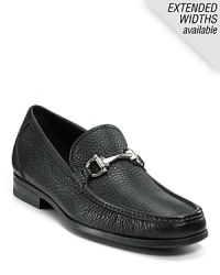 Crafted in soft pebbled leather, this handsome moc toe loafer is finished with the signature gancini logo bit at the tongue. Crafted in soft pebbled leather, this handsome moc toe loafer is finished with the signature gancini logo bit at the tongue.