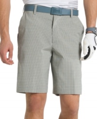 You'll be ready for another round in these plaid, flat-front Izod shorts with UPF 15 and moisture-wicking for comfort.