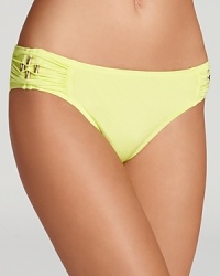 Brilliant color and retro-right goldtone hardware define a deceptively simple bikini bottom from designer Trina Turk. Brilliant color and retro-right goldtone hardware define a deceptively simple bikini bottom from designer Trina Turk.