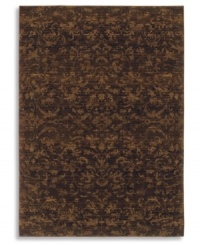 Crafted to impart a vintage wear and lush visual texture, this Karastan rug features subtle fabric-like patterning inspired by the organic designs found in granite and marble. Machine woven from 100% wool in a rich espresso hue. Crafted to impart a vintage wear and lush visual texture, this Karastan rug features subtle fabric-like patterning inspired by the organic designs found in granite and marble. Machine woven from 100% wool in a rich espresso hue.