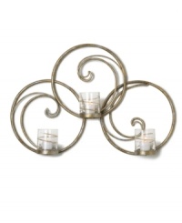 Equal parts wall art and lighting solution, the Symphony Swirl Ring sconce by Mikasa illuminates a room with a festive twist. Featuring whimsical swirls of goldtone metal and glass candle holders wrapped in shimmering ribbons. Equal parts wall art and lighting solution, the Symphony Swirl Ring sconce by Mikasa illuminates a room with a festive twist. Featuring whimsical swirls of goldtone metal and glass candle holders wrapped in shimmering ribbons.