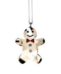 Simply adorable! This cute gingerbread man in Golden Shadow crystal is a real charmer with his Siam crystal bow tie, twinkling Jet eyes and friendly smile. Hanging on a white satin ribbon, this wonderfully nostalgic creation lends a sweet, festive touch to your Christmas tree or window. Simply adorable! This cute gingerbread man in Golden Shadow crystal is a real charmer with his Siam crystal bow tie, twinkling Jet eyes and friendly smile. Hanging on a white satin ribbon, this wonderfully nostalgic creation lends a sweet, festive touch to your Christmas tree or window.