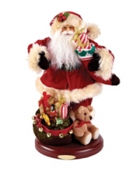 Looking ever-so-handsome, this traditional Santa Claus figurine by Christopher Radko is beautifully dressed in his holiday best and carrying a stocking-full of gifts. With a satchel of toys at his feet and extraordinary detail for a feeling of warmth and good cheer. Looking ever-so-handsome, this traditional Santa Claus figurine by Christopher Radko is beautifully dressed in his holiday best and carrying a stocking-full of gifts. With a satchel of toys at his feet and extraordinary detail for a feeling of warmth and good cheer.