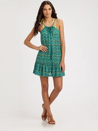 An irresistible pattern lends feminine charm to this brilliant coverup with a self-tie neckline. Self ties at necklineGold cord endsRuffle hem53.6% polyamide/27.2% polyester/16.48% spandexHand washImported An irresistible pattern lends feminine charm to this brilliant coverup with a self-tie neckline. Self ties at necklineGold cord endsRuffle hem53.6% polyamide/27.2% polyester/16.48% spandexHand washImported