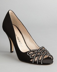 These evening shoes dazzle, with strap after strap of rhinestone after rhinestone starring against sleek satin; from Caparros. These evening shoes dazzle, with strap after strap of rhinestone after rhinestone starring against sleek satin; from Caparros.
