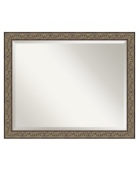 A black-washed golden hue and classic vine motif make this wall mirror at home in refined country decor. The narrow bronze frame and beveled mirror edge put the focus on your reflection and accent the bedroom, dining room or foyer with a distinctly feminine grace. A black-washed golden hue and classic vine motif make this wall mirror at home in refined country decor. The narrow bronze frame and beveled mirror edge put the focus on your reflection and accent the bedroom, dining room or foyer with a distinctly feminine grace.