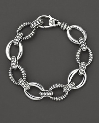 Smooth and fluted link sterling silver bracelet, with a logo lobster clasp. Designed by Lagos. Smooth and fluted link sterling silver bracelet, with a logo lobster clasp. Designed by Lagos.