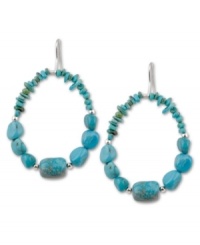 A striking silhouette. Turquoise nuggets and chips add dimension to this stunning pair of drop hoops by Avalonia Road. Set in sterling silver on fish wire. Approximate drop: 2 inches. A striking silhouette. Turquoise nuggets and chips add dimension to this stunning pair of drop hoops by Avalonia Road. Set in sterling silver on fish wire. Approximate drop: 2 inches.
