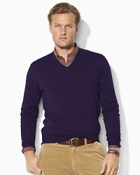 A classic-fitting V-neck sweater is crafted from luxe merino wool, making it the perfect preppy layering piece for when the temperature begins to drop. A classic-fitting V-neck sweater is crafted from luxe merino wool, making it the perfect preppy layering piece for when the temperature begins to drop.