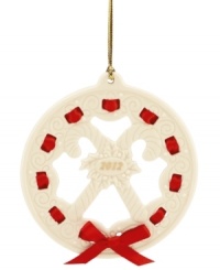 All wrapped up in a holiday bow, this graceful wreath ornament makes a memorable gift for 2012. With carved candy canes, holly and pretty scrolling detail in Lenox porcelain. All wrapped up in a holiday bow, this graceful wreath ornament makes a memorable gift for 2012. With carved candy canes, holly and pretty scrolling detail in Lenox porcelain.