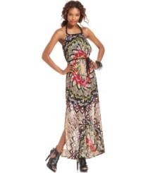 A butterfly-inspired floral print makes a summer statement on this Andrew Charles maxi dress -- a side slit adds eye-catching appeal! A butterfly-inspired floral print makes a summer statement on this Andrew Charles maxi dress -- a side slit adds eye-catching appeal!
